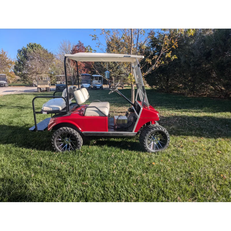 1994 Club Car RED DS 48volt with lights flip seat lifted 6″ with new wheels and tires